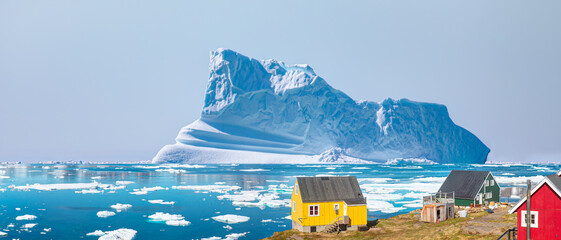 Panoramic view of colorful Kulusuk village in East Greenland - Kulusuk, Greenland - Melting of a...