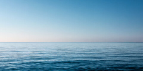 Calm ocean view with clear sky during early morning hours at a tranquil coastal location