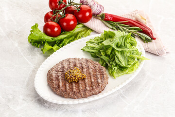 Frilled beef burger cutlet with iceberg