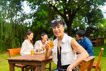4K Group of Happy Asian millennials people enjoy and fun celebration reunion meeting holiday event at outdoor dinner party with food and drink together in the garden at restaurant on vacation night.