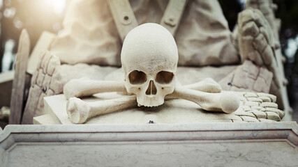 Skull, statue or grave with bones for halloween, ancient treasure or historic monument of death in...