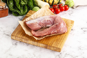 Uncooked raw pork tenderloin with spices