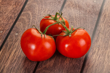 Sweet ripe tomatoes on the branch