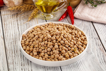 Dry chickpea seeds heap in the bowl