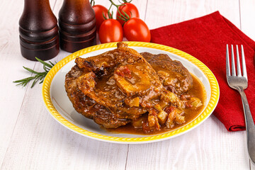 Italian cuisine - ossobuco with sauce