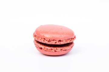 Close-up of pink raspberry macaroon biscuit