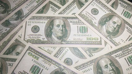 collection of money stacks of 100 US dollar banknotes that make up a large portion, purpose for  background,