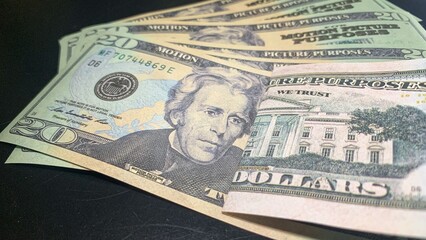 20 dollars on a black background. Close-up.