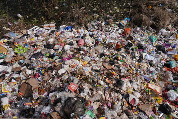 Lots of garbage has been dumped in a place cause of pollution