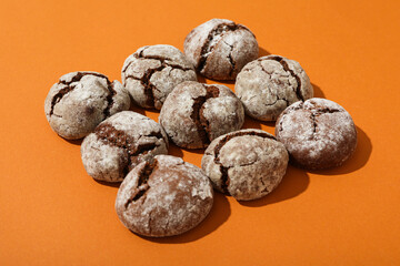 Appetizing Grinkle cookies on an orange background.