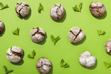 Grinkle cookies with mint, on a green background.