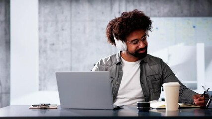 Young African American Man Using Computer For Online Webinar Course