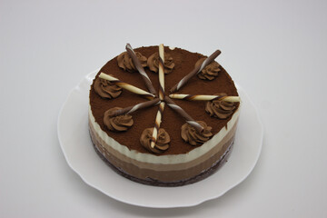 Chocolate Cake with Decorative Swirls and Sticks