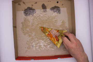 Hand Reaching for Last Slice of Pizza in Box