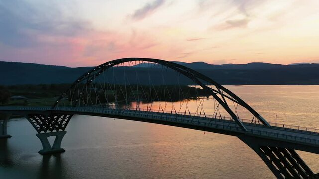 Aerial view circling the Lake Champlain Bridge, colorful dusk in Vermont. USA