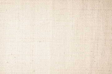 Closeup detail of beige fabric texture background. High resolution photo.
