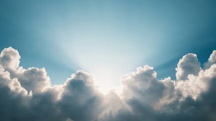 A serene view of fluffy clouds bathed in sunlight, creating a beautiful contrast against a bright blue sky.