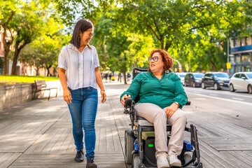 Woman with disability and friend talking along the city
