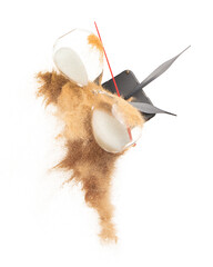 Close up of Sand Hourglass, clock hands arms and sand explosion over white background isolated. Sand through time hourglass waste fall down as time management concept