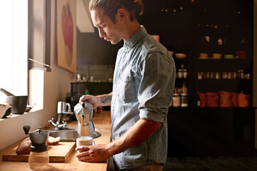 Man, barista and coffee with art at cafe for espresso process, catering service and drink production. Male server, beverage and pattern with morning start, latte order and preparation for hospitality