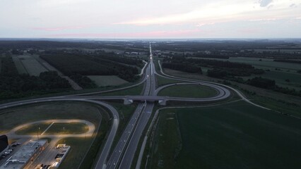 Nighttime aerial of busy freeway intersection