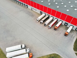 Fleet of Trucks at Warehouse Loading Area