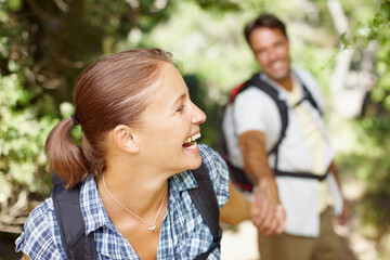 Naklejka premium Happy woman, laughing or couple in woods for hiking, adventure or travel journey on break in nature. Funny, smile or face of people in Italy holding hands for holiday trip or trekking to explore park