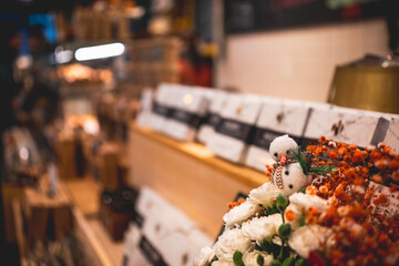 Snowman Decoration and Flowers at Kaffebrenneriet Cafe in Oslo