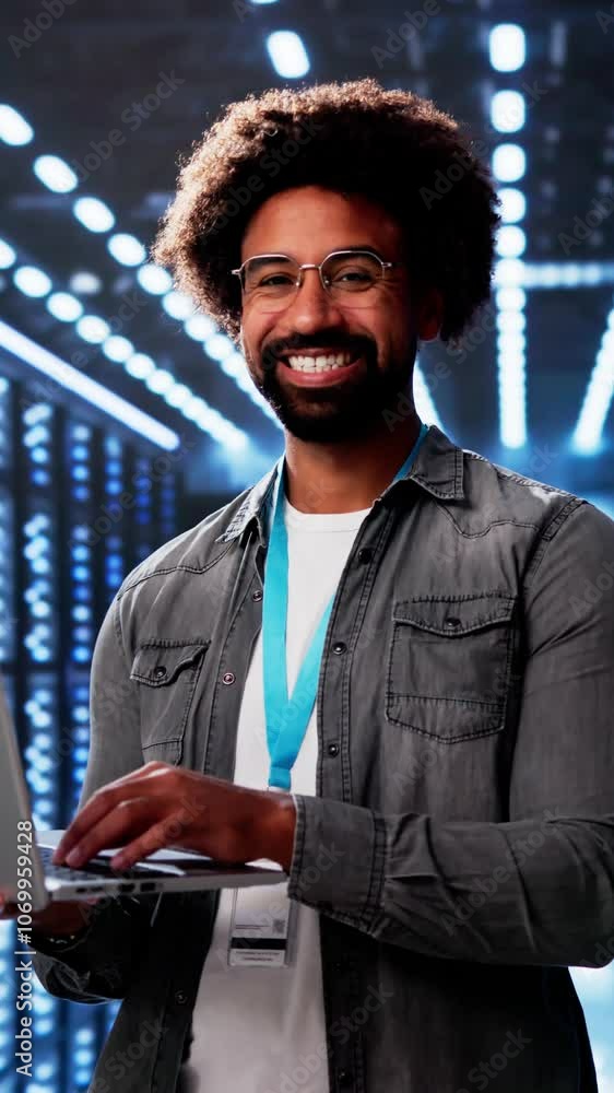 Poster happy engineer in data center server room configuring ai