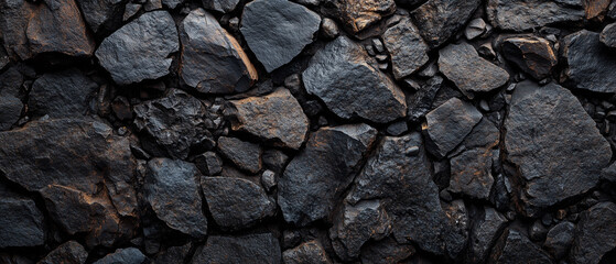 Fototapeta premium Rugged Black Rocks Create a Stunning Natural Wall.