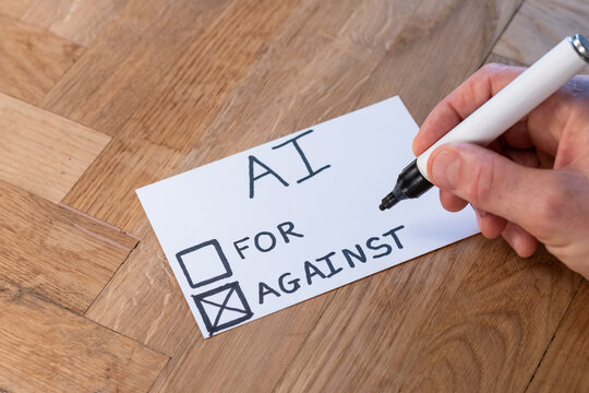 human hand with pen casts negative vote on popular trending topic AI Artificial Intelligence. Public opinion varies on computer automation and ethics. people resist modern technology 