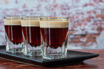 St. Patrickâ€™s Day cocktail of layered Irish cream and coffee liqueur made to look like mini stout shot