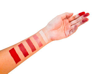 A woman's hand tries to apply a cosmetic product lipstick on her hand neatly in a square shape,...