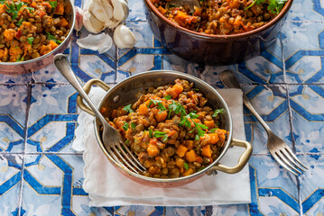 Brown lentils stew with white wine, serrano ham and smoked paprika