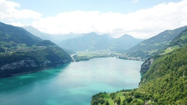 Establishing shot of Lake Walen a stunning swiss lake, forms the western end of the region Heidiland for the world-famous Heidi story. Walensee, Switzerland