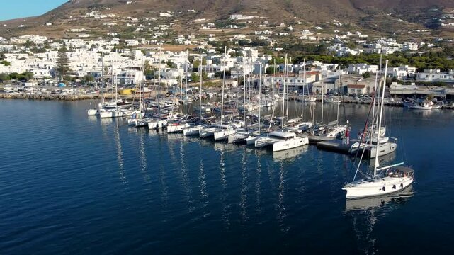 Aerial Orbit View over Parikia Marine full of Moored Sailing Boats, Greece
