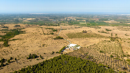 Aerial view of the Murgia Valley in Puglia, Italy. In the background is the Adriatic Sea.
