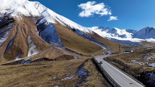 Aerial view with Lorry truck on the road surrounded by winter Landscape	