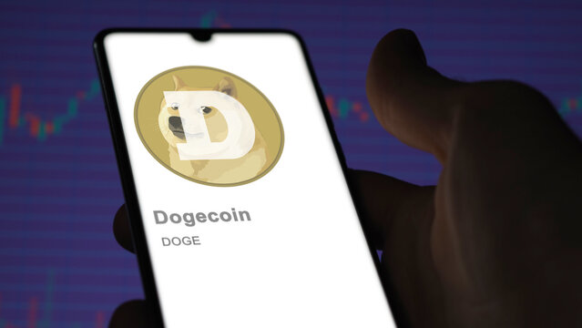 DOGE Dogecoin on the screen of an exchange. (DOGE) dogecoin price stocks, $DOGE on a device.