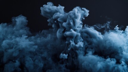 Naklejka premium A mesmerizing blue smoke formation gently swirls against a dark background, creating a mystical atmosphere.