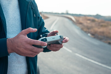 man with remote control holding a remote control