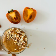 Tasty Chocolate Persimmon Pudding Garnished with Crushed Nuts