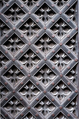 a close up of a decorative pattern of a wooden door.