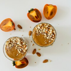 Tasty Chocolate Persimmon Pudding Garnished with Crushed Nuts
