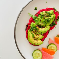 Toast with Beet Hummus with Avocado and Veggies