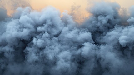 Obraz premium A captivating view of dense gray smoke swirling against a soft orange background.