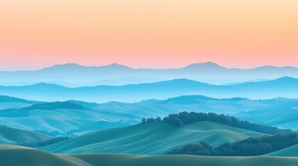 Obraz premium A panoramic view of a rolling, misty green hills landscape with a pink and blue sky at sunrise.