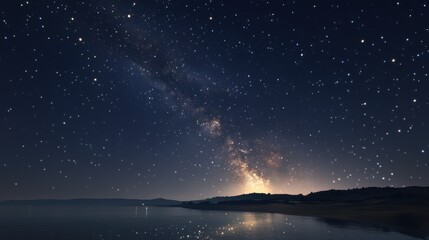 Obraz premium A stunning view of the Milky Way galaxy over a calm lake, showcasing bright stars against a dark night sky.