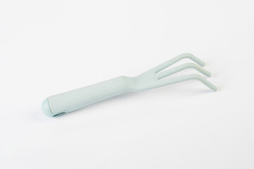 Garden tools with blue grips on a white background