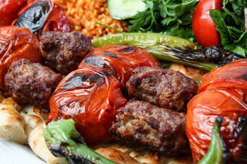 traditional turkish meatball kebab tomato and rice. turkish kebab hot meatball spicy